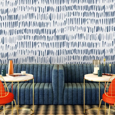 The wallpaper at Cafe Lello features a chic blue pattern. Elements include intricate designs and motifs in varying shades of blue.