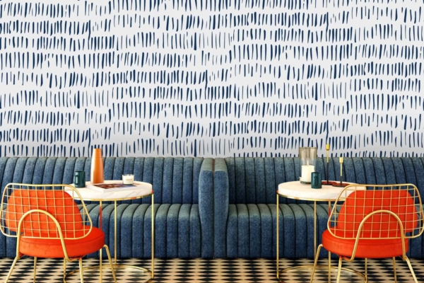 The wallpaper at Cafe Lello features a chic blue pattern. Elements include intricate designs and motifs in varying shades of blue.