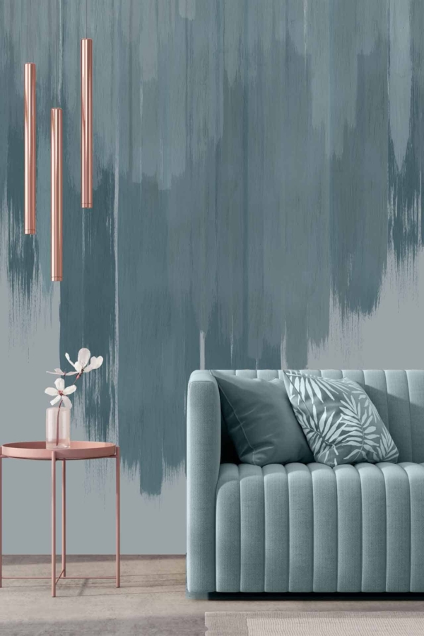 The wallpaper is a sophisticated blend of teal and gray, featuring intricate patterns of palm leaves and abstract shapes. Splashes of pink are interwoven delicately throughout, harmonizing with the room's decor. The combination of these elements creates a modern yet inviting ambiance.