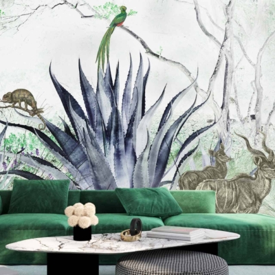 The wallpaper in the living room features a striking tropical-themed mural with a vibrant agave plant, two graceful antelopes, a colorful parrot, and a camouflaged chameleon. The lush green tones of the agave blend seamlessly with the detailed fur patterns of the tan and brown antelopes. Bright splashes of blue, yellow, and red highlight the parrot perched amidst foliage. The chameleon displays shifting hues of green and subtle hints of orange to blend into its surroundings. This eclectic mix of exotic fauna against rich botanical elements brings an air of wild elegance to the room's decor.