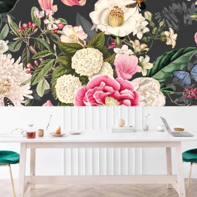 The wallpaper showcases a large, vibrant floral mural featuring various flowers, leaves, and butterflies on a dark background. The colors include bright pinks, yellows, blues, greens, and pops of white against deep hues for dramatic contrast.