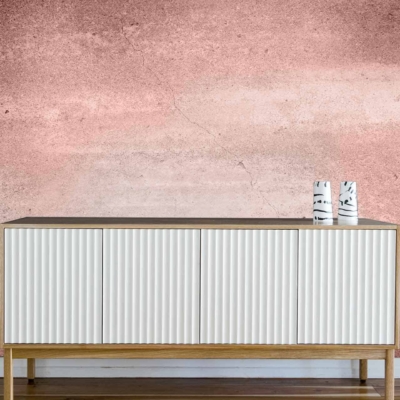 Textured, faded pink wall with subtle elegance.
