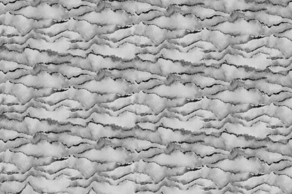 Abstract grayscale background wallpaper featuring a pattern resembling torn paper edges layered horizontally. The texture is rough and fragmented, creating a wave-like effect throughout the image. Key elements include: grayscale tones, torn paper pattern, horizontal layers, rough texture, and wave-like fragmentation.
