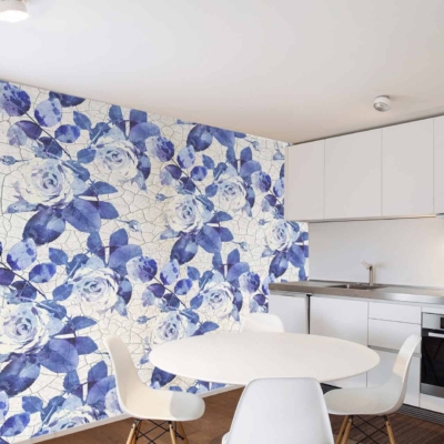 Bold accent wall, mosaic pattern, large blue and white Delft roses, vibrant artistic look.