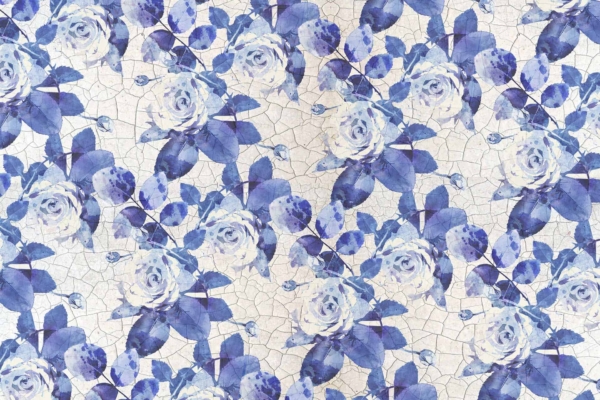 Seamless pattern wallpaper featuring Delft blue roses with delicate white highlights, paired with green leaves. The design sits on a cracked, off-white background for a vintage, textured look. Intricate and repetitive floral elements accentuate the classic aesthetic.