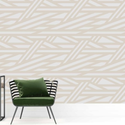 A modern interior features a wall with a geometric beige and white pattern. The wallpaper includes elements such as beige shapes combined with white lines, creating a stylish, contemporary design.