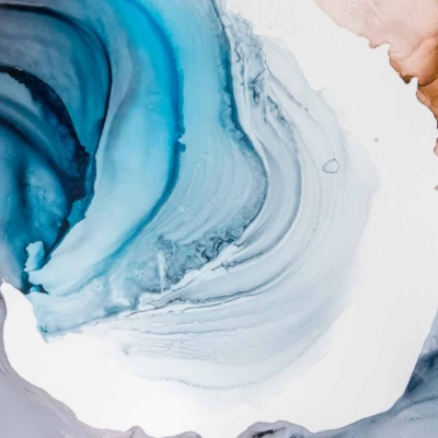 Abstract watercolor wallpaper with swirling patterns. Shades of blue, white, and brown blend fluidly, creating a sense of movement. Waves or flowing liquid motifs are prominent. Elements include soft gradients, dynamic motion, and harmonious color transitions in water-like textures.