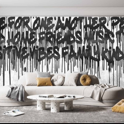 Bold, dripping black graffiti featuring words like