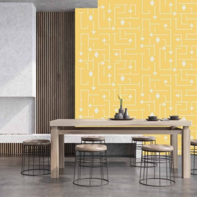 The back wall showcases a vibrant yellow geometric wallpaper pattern, featuring bold lines and shapes. The striking design pairs warm yellow hues with sharp geometric elements, making it a focal point in the modern dining space.