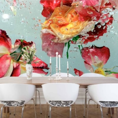 The dining room features a large wall mural of various flowers, including delicate roses, submerged in aqua-toned water with bubbles. The wallpaper is vibrant and dynamic with floral elements and shades of aqua.