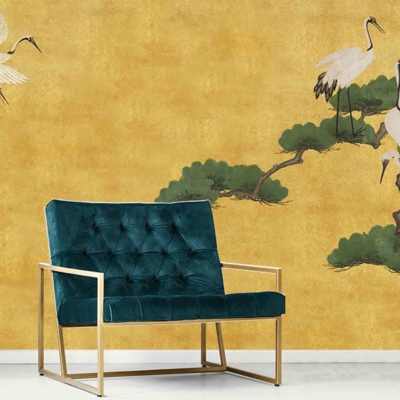 Yellow wall mural, elegant cranes, tree branches, reminiscent of Asian Nights.