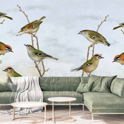 The wallpaper showcases a mural of birds perched on twigs against a serene sky and tree background. Key elements include delicate birds, intricate twigs, and softly blended skies. Colors primarily feature various shades of green, blue, and subtle earth tones to evoke a peaceful natural setting.