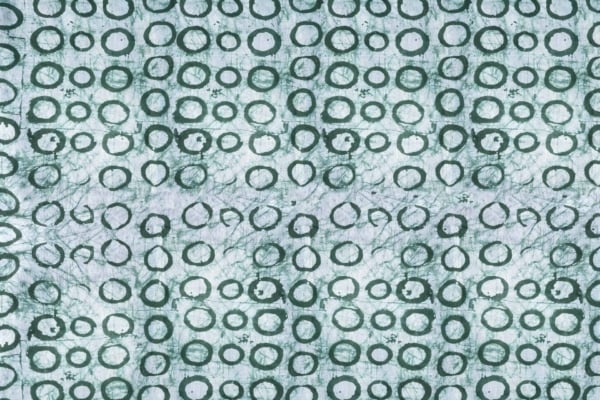 Abstract wallpaper featuring repeated green circular designs on a white background. Circles vary in size with a hand-drawn, textured, organic feel reminiscent of Buhle's style. Shades of green range from light to dark. Key elements: green circles, hand-drawn texture, organic design, white background.