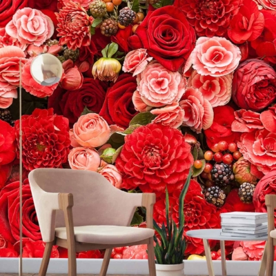 Vibrant bursting berries floral wall with red and pink roses.