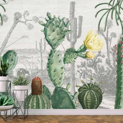 The wallpaper in Cactus Heaven features watercolor illustrations of various cacti species set against a desert landscape. It includes shades of green, brown, and beige with touches of yellow and pink accents found in cactus flowers. The elements include saguaro, prickly pear, and barrel cactus, along with desert flora like agave and yucca.