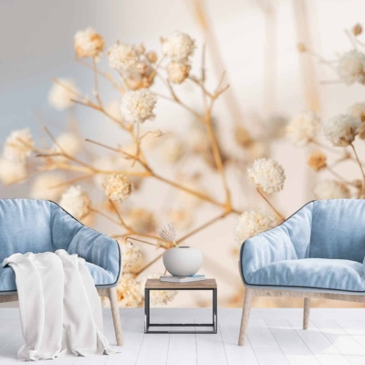 The wallpaper is a large mural featuring delicate dried flowers. The design showcases intricate floral patterns, predominantly in soft hues like beige, light brown, and subtle hints of cream. The dried flowers are intricately detailed, giving a natural and vintage feel to the space.