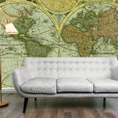 The wallpaper is a large vintage world map with muted earth tones and subtle beige, sepia, and soft brown hues. It highlights intricate cartographic lines, aged patina effects, and maritime illustrations that evoke the spirit of voyage.