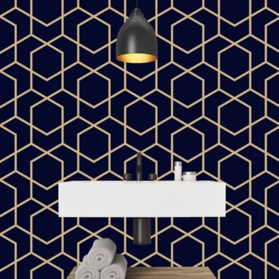 Contemporary bathroom features a striking geometric hexagon-patterned navy wallpaper, characterized by clean lines and sharp angles. The deep navy serves as the base color, complemented by subtle metallic accents within the hexagonal shapes for added depth and sophistication.