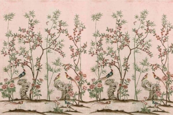 Wallpaper with repeating pattern of birds perched on branches, bamboo stalks, and blossoming flowers. Elements in muted green, pink, and beige tones. Background in soft blush pink. Traditional Eastern artwork style.