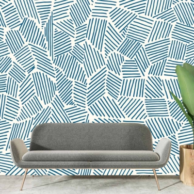 Abstract blue geometric pattern on white wall.