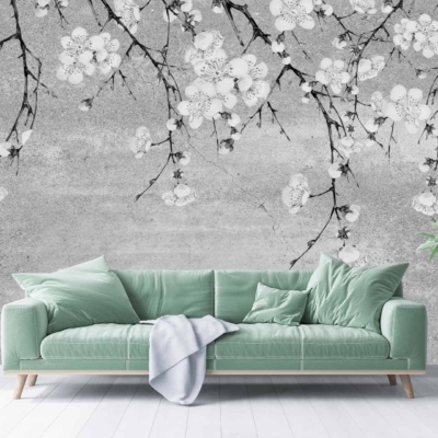 The wallpaper features a Chinoiserie mural depicting delicate white cherry blossoms on contrasting black branches.