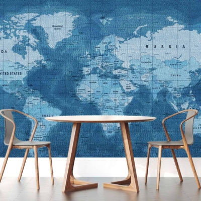 The wallpaper showcases a large world map in shades of blue, featuring clearly marked country names and borders. The design adds a touch of global fashion reminiscent of classic denim styles, with varying hues and tones that create depth and interest.