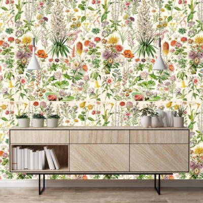 The wallpaper features vibrant floral patterns with blooming roses, daisies, and peonies in shades of pink, red, yellow, and white. Lush green leaves intertwine throughout the design. The pattern is rich with botanical elements from Elizabeth's Garden collection.
