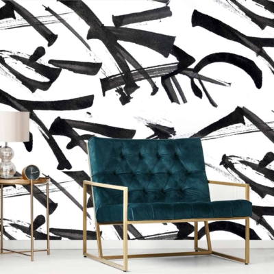 The wallpaper features free hand abstract black brush strokes on a white surface. This contemporary design offers an artistic vibe with its bold, contrasting elements and minimalistic color palette. Ideal for modern living spaces seeking a unique and stylish backdrop.