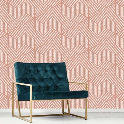 The wallpaper features a geometric pattern in shades of pink and white, adding a modern and vibrant touch to the room. The mix of these colors creates an eye-catching backdrop that enhances the overall aesthetic.