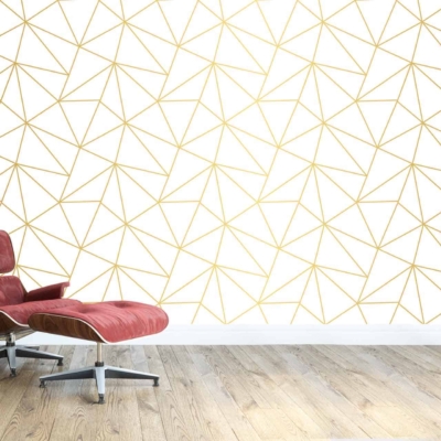 The wallpaper features a white background with a gold geometric pattern. The design includes symmetrical shapes and clean lines that create a modern yet elegant look. The use of metallic gold against the pure white adds a touch of luxury and sophistication to the minimalist space.