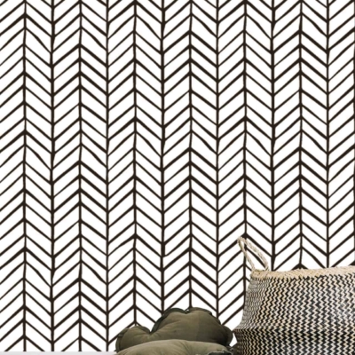 The room's wallpaper features a black and white herringbone pattern.