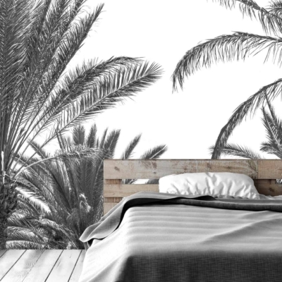 Mural wallpaper features tall, detailed palm trees in black and white, creating a serene, island-hopping ambiance.