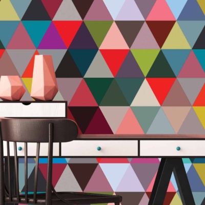 The wallpaper features a colorful, vibrant pattern of multicolored triangles, some forming isosceles shapes. It combines various hues in a geometric design, reminiscent of geometry class.