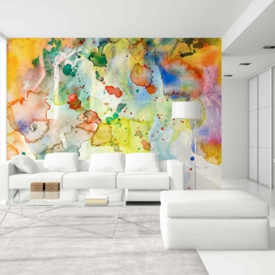 The focal point of the modern living room is a striking abstract watercolor mural crafted with Jacksons' premium paint. The wallpaper features dynamic swirls of deep blues, vibrant yellows, and calming greens, seamlessly blending with hints of soft purples and subtle pinks. Bold splashes and delicate brushstrokes create a sense of movement and depth. The large-scale design ensures that each element—from intricate dots to broad strokes—contributes to a visually captivating centerpiece.