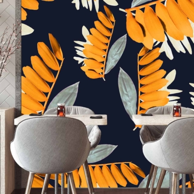 The wallpaper features Joany's vibrant orange and muted green leaf patterns set against a bold, dark background.
