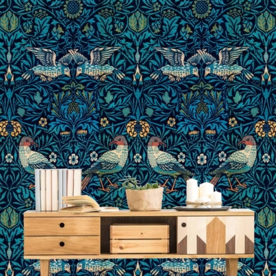 Dark teal wallpaper with symmetrical bird and floral designs, intricate patterns, historical charm, Leicester-inspired elements.