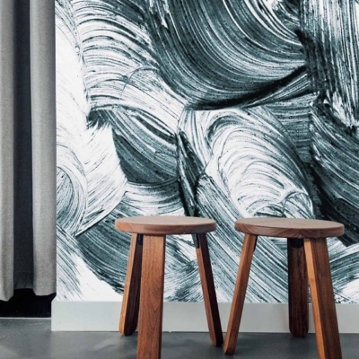 Wall features a bold, abstract black and white brushstroke pattern.