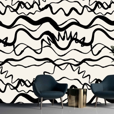 White wall adorned with bold, abstract black wavy lines and squiggles, reflecting unpredictable twists and turns.