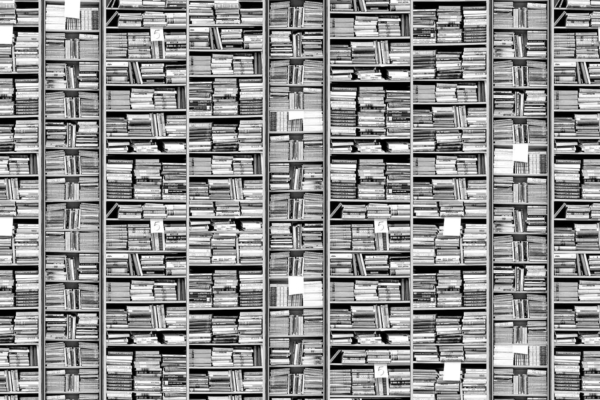 The bookshelf wallpaper features a tightly packed arrangement of books in various orientations. Dominant colors include rich browns and earthy tones from book spines, with occasional splashes of vibrant hues like red, blue, and green covers. Some titles hint at themes of lost pages. The intricate pattern creates a visually dense mosaic that beckons curiosity and exploration.
