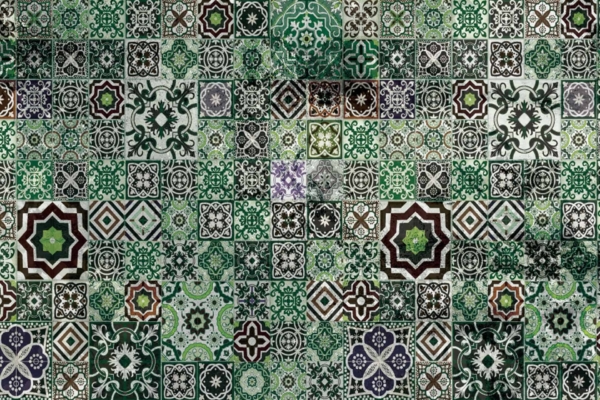 A detailed and intricate tile pattern featuring a variety of geometric and floral designs in shades of green, black, and white. This wallpaper is reminiscent of the vibrant mosaics seen in Marrakech. Each unique tile adds to a visually complex mosaic. The predominantly green palette includes occasional hints of maroon and orange, interwoven with elements like star shapes, arabesques, hexagons, and vines for an ornate design.