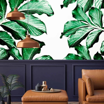The wallpaper features large green leaves, evoking a lush, natural ambiance. The palette includes various shades of green, from vibrant emerald to deep forest tones. The leafy design has intricate detailing that adds depth and texture. This botanical theme underscores the room's connection to Mother Nature.