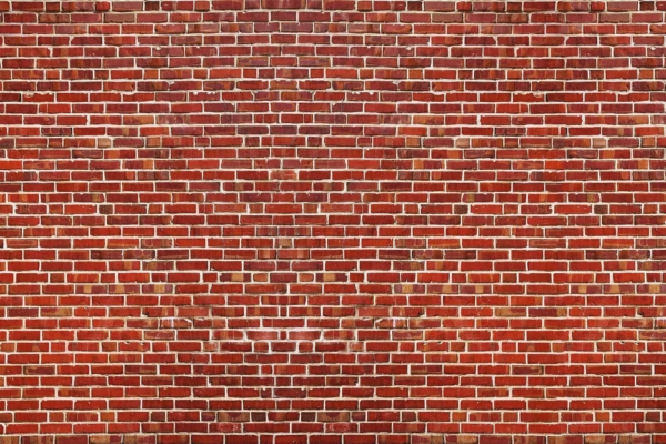 A close-up view of a red brick wallpaper features neatly aligned horizontal rows with slight color variations. The clean and evenly applied mortar stands out between the bricks, showcasing a well-maintained and uniform pattern. Key elements: red brick, horizontal alignment, color variation, even mortar.