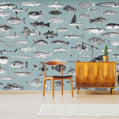 A blue wall features various black and white fish illustrations, giving the space an 