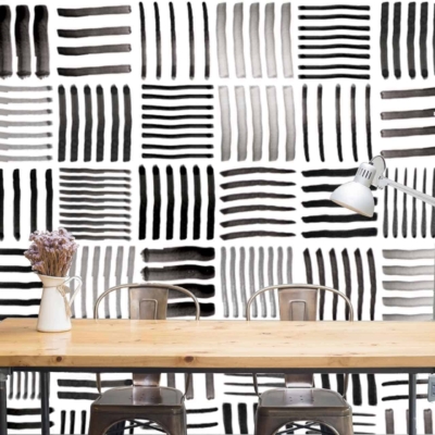 The wallpaper features a black and white abstract pattern with hand-painted stripes. The design emphasizes bold black lines on a white background.
