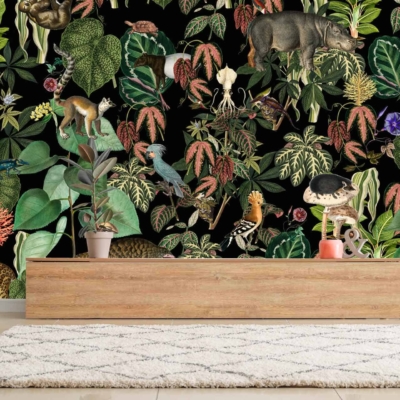 A room with dark background wallpaper featuring various animals and plants. The vivid pattern showcases colorful birds, butterflies, flowers, leaves, and tree branches. Splashes of green, red, orange, yellow, and blue dominate the intricate designs against the dark backdrop.