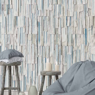 Textured wallpaper with vertical, stacked stone tiles in white and blue.