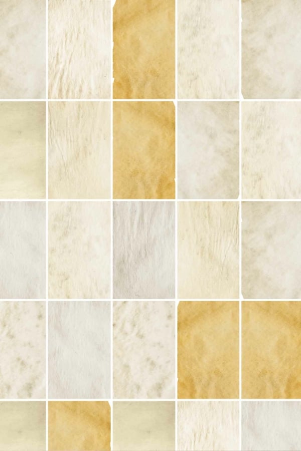 Wallpaper features a patchwork pattern of rectangular tiles in shades of cream, beige, and light brown. Each tile showcases a distinct texture and subtle color variations, evoking a rustic and nostalgic feel reminiscent of worn vintage prints and old paper.