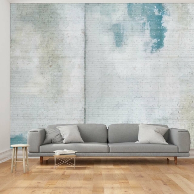 The wallpaper is a distressed design featuring blue and white painted bricks. Elements include the uneven texture of brick and varying shades of blue mixed with white.