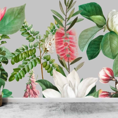 A wall mural featuring vibrant, large illustrated flowers and leaves in shades of green, pink, red, and white captures the essence of 