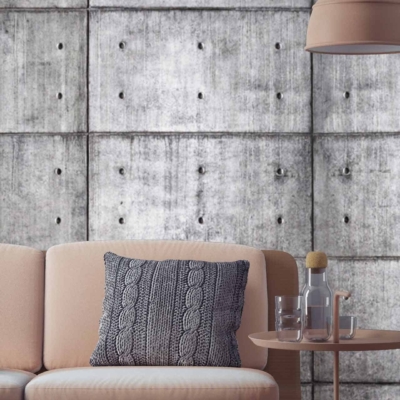 Raw concrete wallpaper with visible panels and bolts.